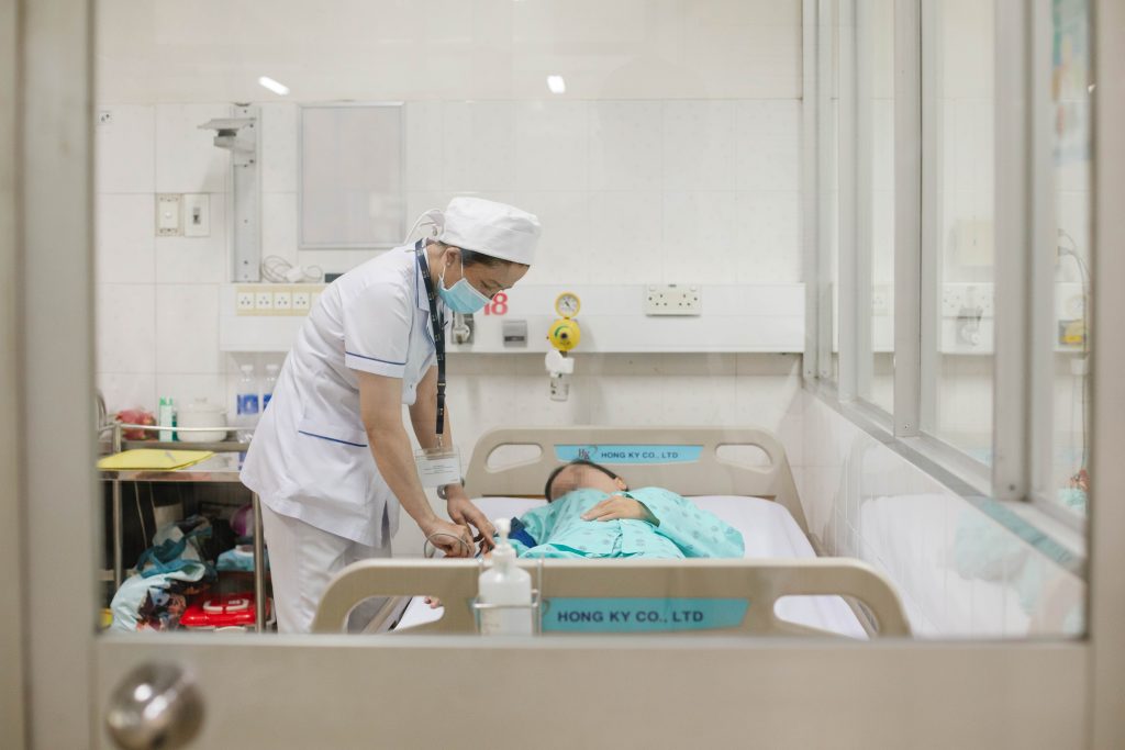 nurse putting D-SCAPE on patient in Hospital for Tropical Diseases nurse putting D-SCAPE on patient in Hospital for Tropical Diseases
