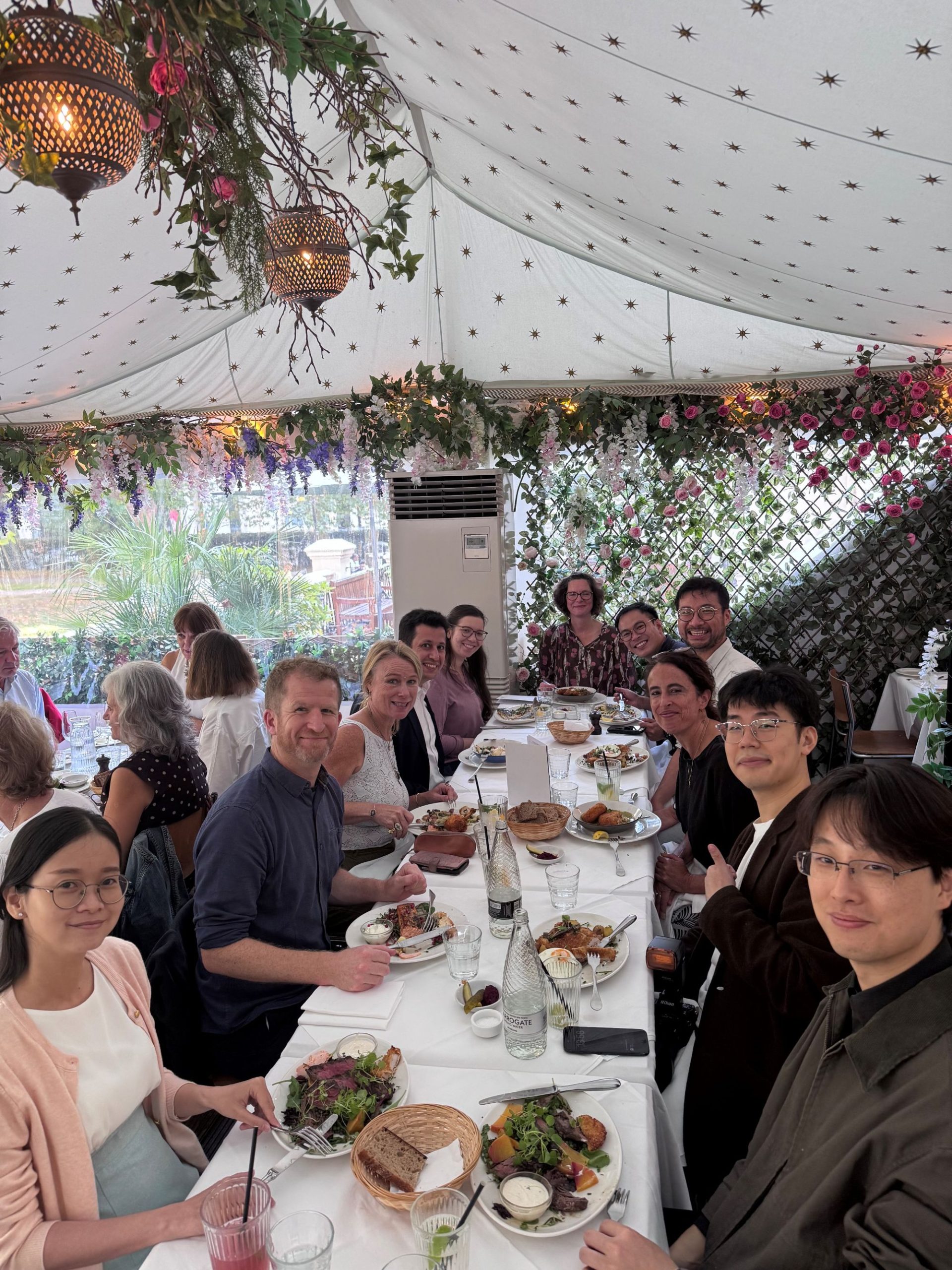 The D-SCAPE team sitting at a restaurant