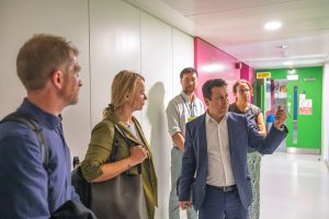 Pantelis Georgiou showing people around the lab